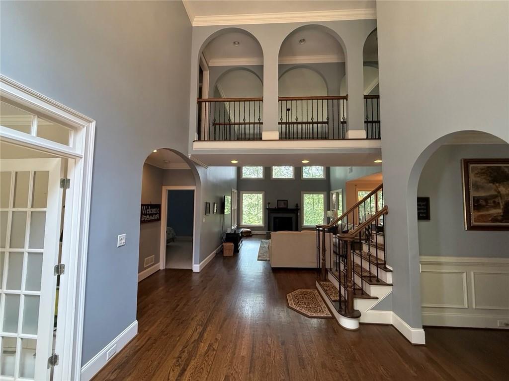 8350 Jacobs Ridge Lane Cumming, GA 30028 - Photo 5 of 68 a view of a living room filled with furniture and wooden floor