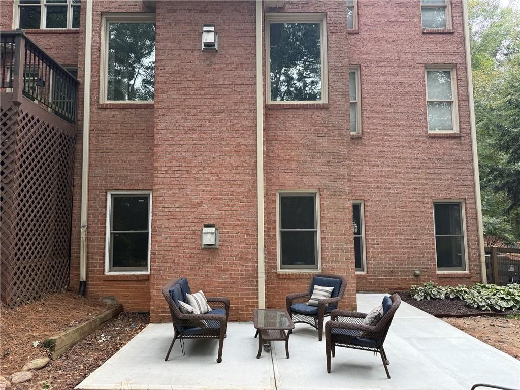 8350 Jacobs Ridge Lane Cumming, GA 30028 - Photo 56 of 68 a building outdoor space with patio furniture