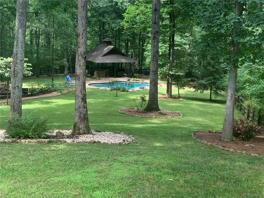 8350 Jacobs Ridge Lane Cumming, GA 30028 - Photo 59 of 68 a view of a park with a tree