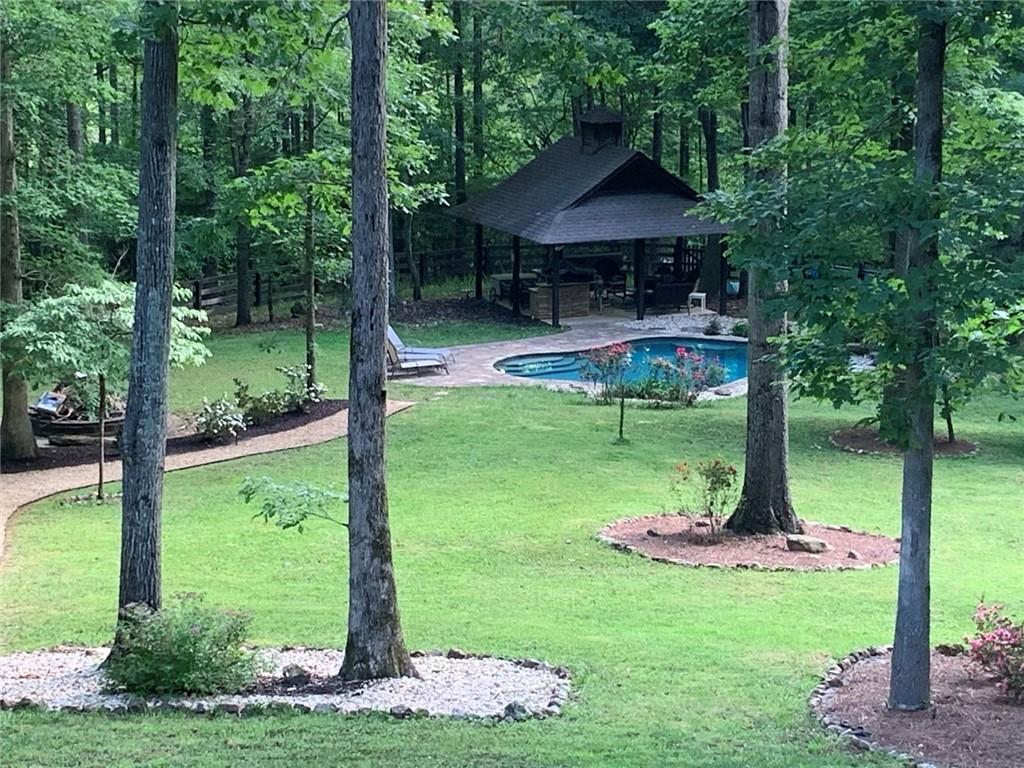 8350 Jacobs Ridge Lane Cumming, GA 30028 - Photo 61 of 68 a garden view with a seating space