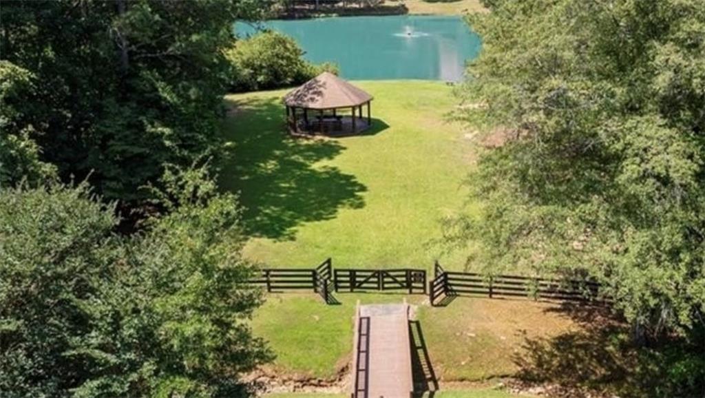 8350 Jacobs Ridge Lane Cumming, GA 30028 - Photo 68 of 68 a view of a lake with a yard