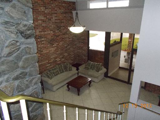 850 South Lorraine Road, Unit 2K Wheaton, IL 60189 - Photo 2 of 9 a balcony with furniture and a potted plant