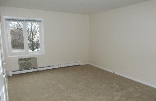 850 South Lorraine Road, Unit 2K Wheaton, IL 60189 - Photo 5 of 9 an empty room with a window