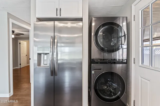 a view of a hallway with washer and dryer