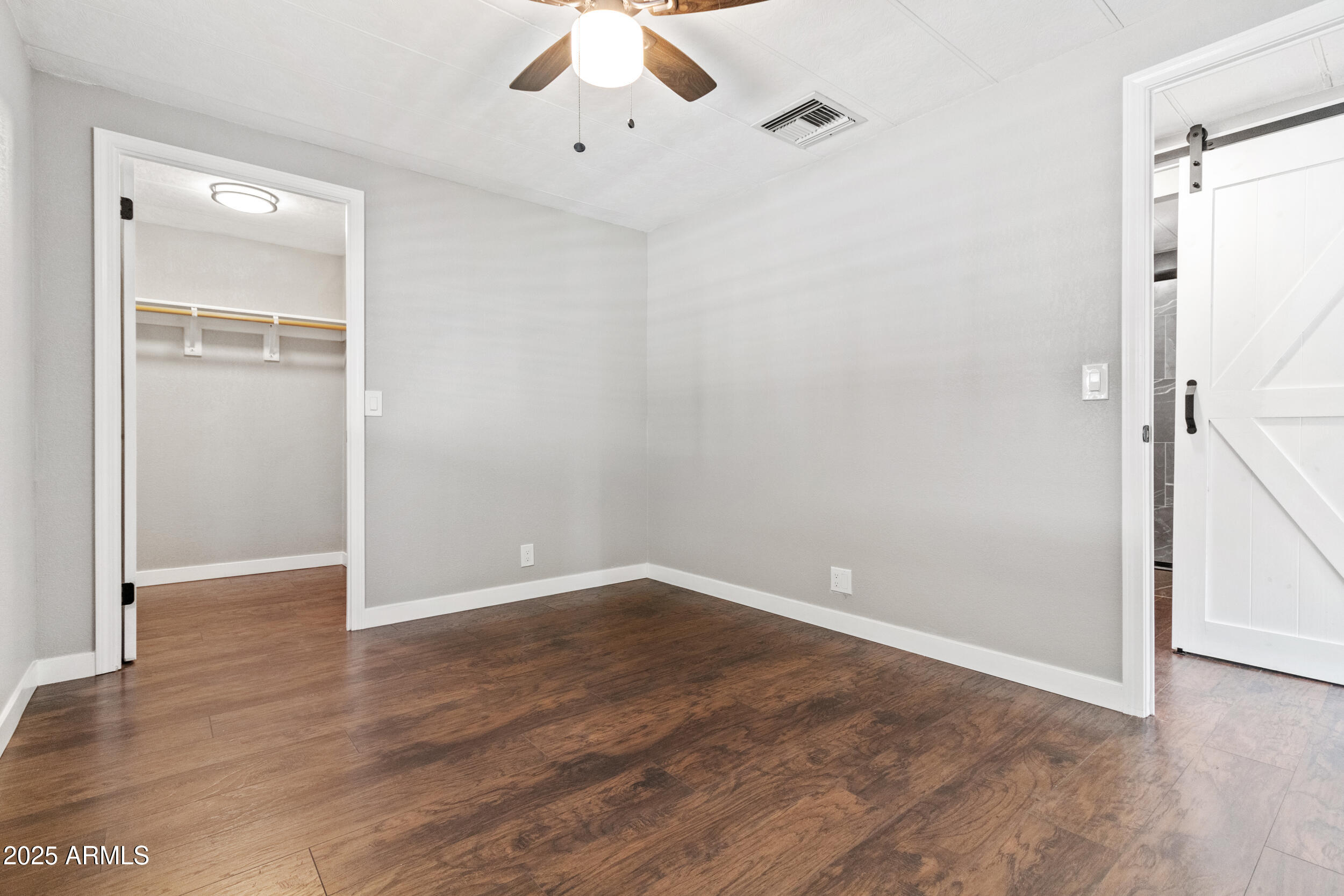 2401 West Southern Avenue, Unit 224 Tempe, AZ 85282 - Photo 18 of 47 a view of an empty room with wooden floor