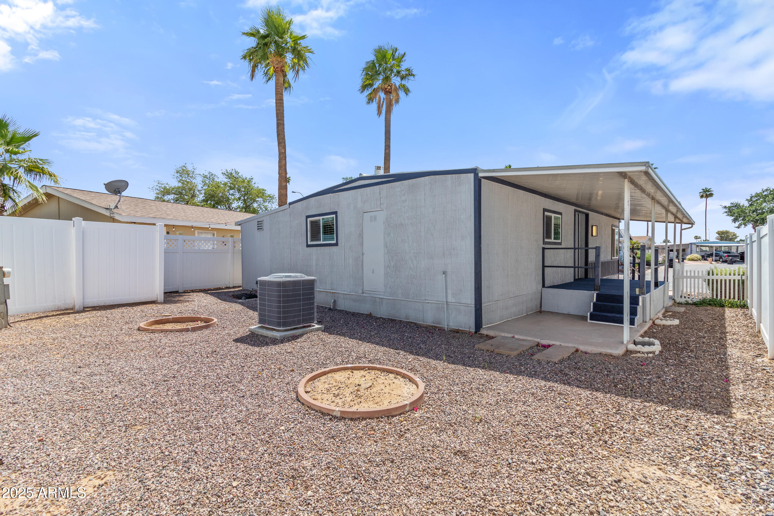 2401 West Southern Avenue, Unit 224 Tempe, AZ 85282 - Photo 27 of 47 a backyard of a house with barbeque oven table and chairs