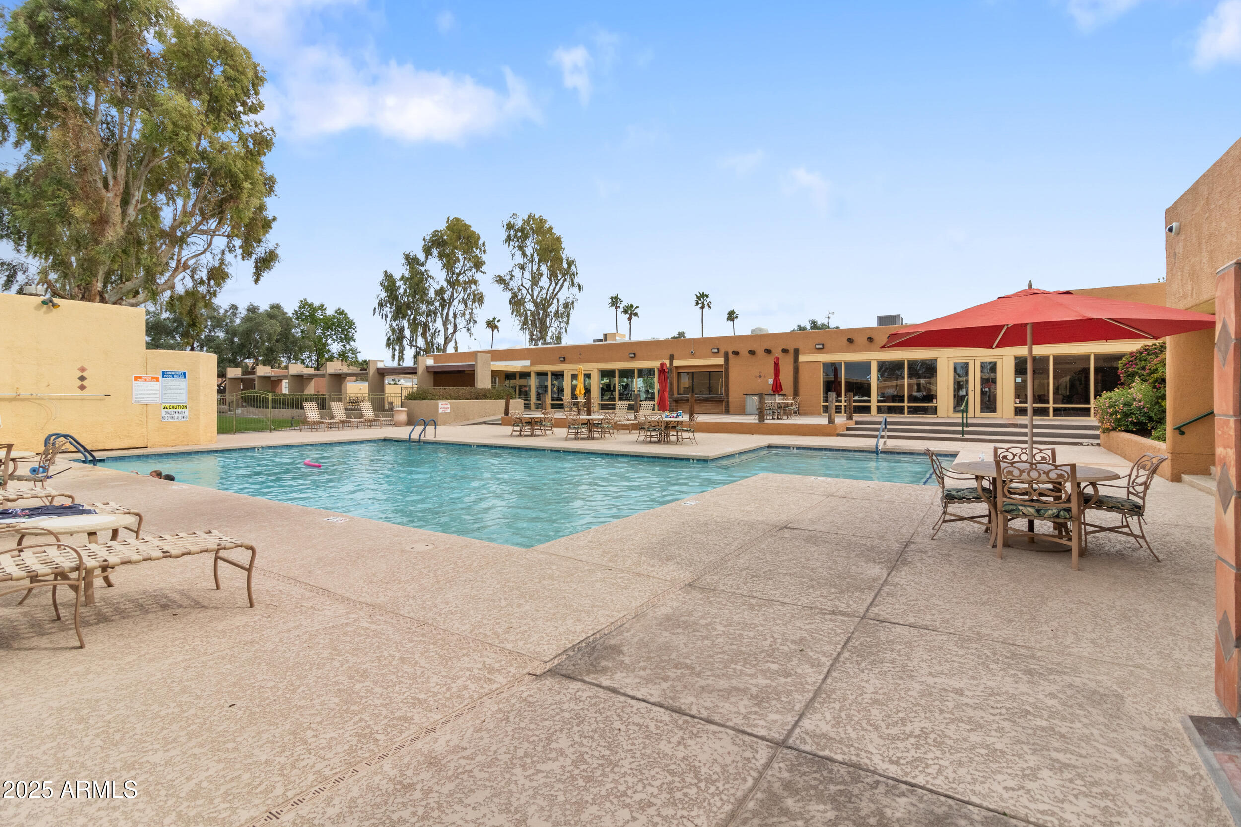 2401 West Southern Avenue, Unit 224 Tempe, AZ 85282 - Photo 33 of 47 a view of a lake with lawn chairs and a table