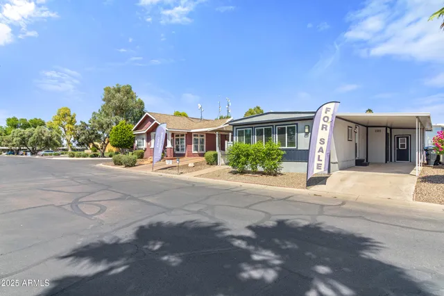 a front view of a house with a yard and a garage