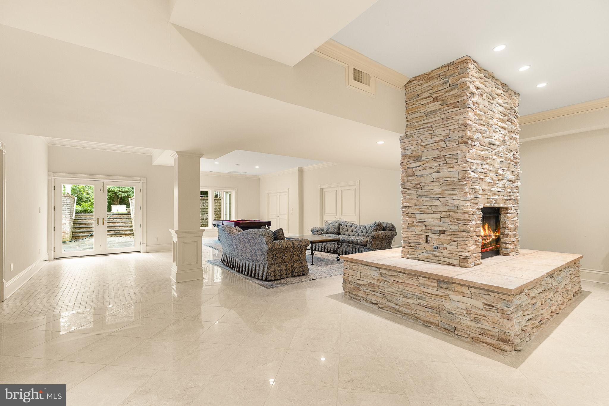11195 Gunston Road Lorton, VA 22079 - Photo 100 of 118 Lower level family room double sided gas fireplace