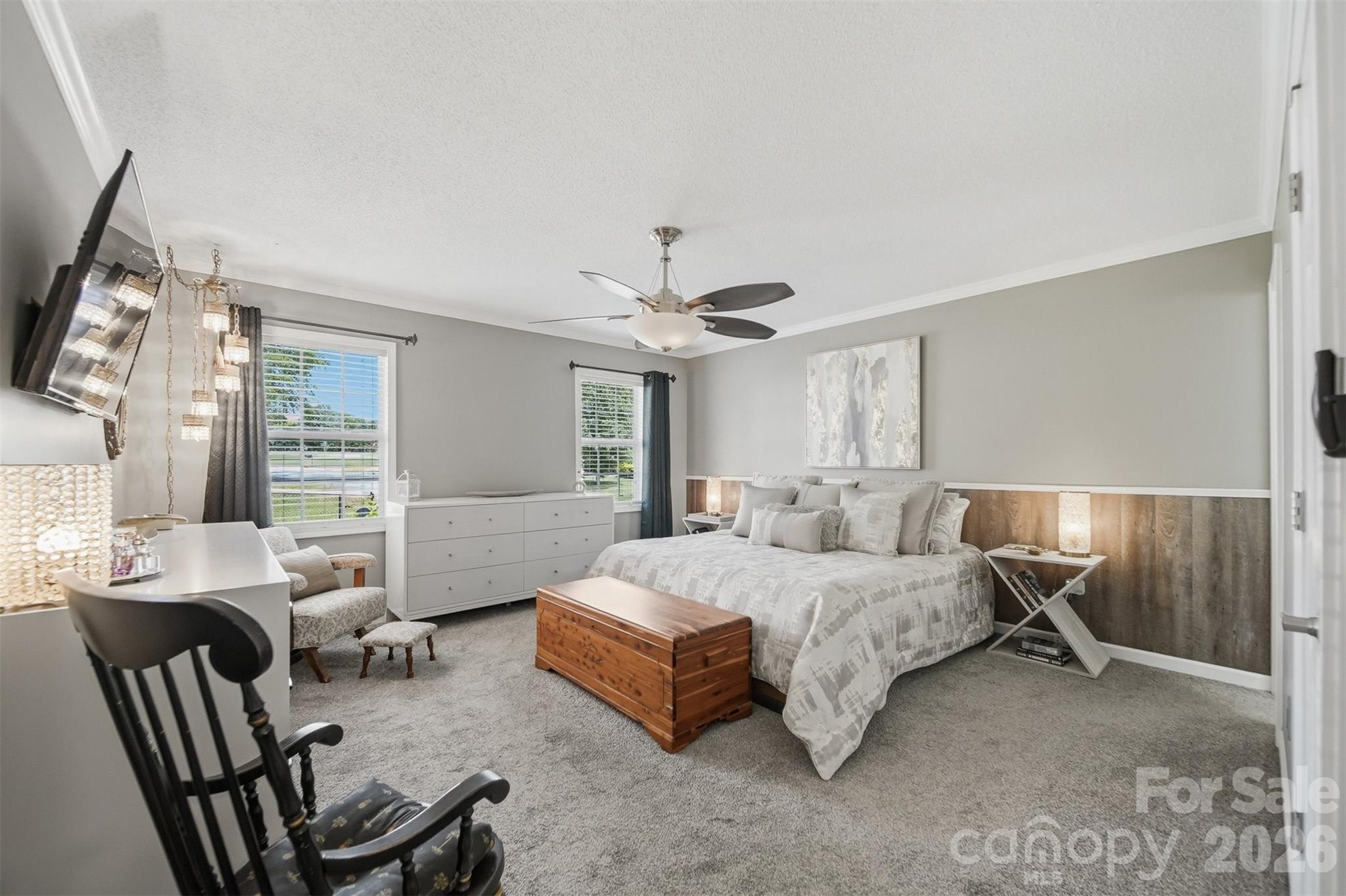 2104 Sheffield Court Northwest Conover, NC 28613 - Photo 11 of 25 a bedroom with a bed and a chandelier