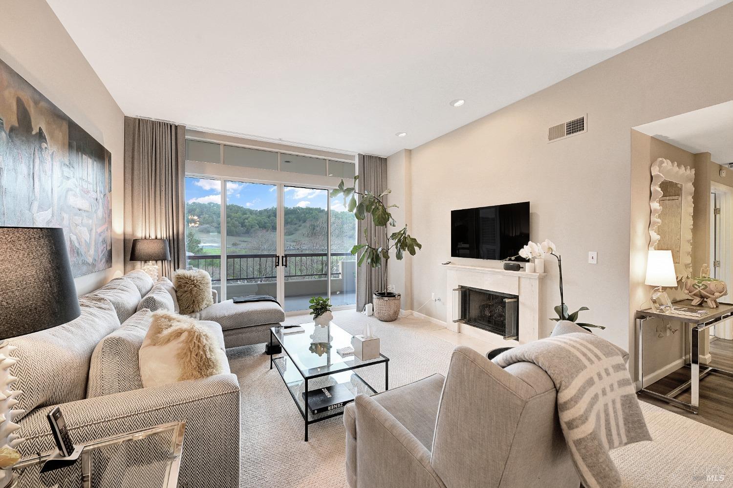 300 Deer Valley Road, Unit 4A San Rafael, CA 94903 - Photo 1 of 1 Stunning Living Room with 10' ceilings, gas fireplace with remote~ Hillside views facing west.