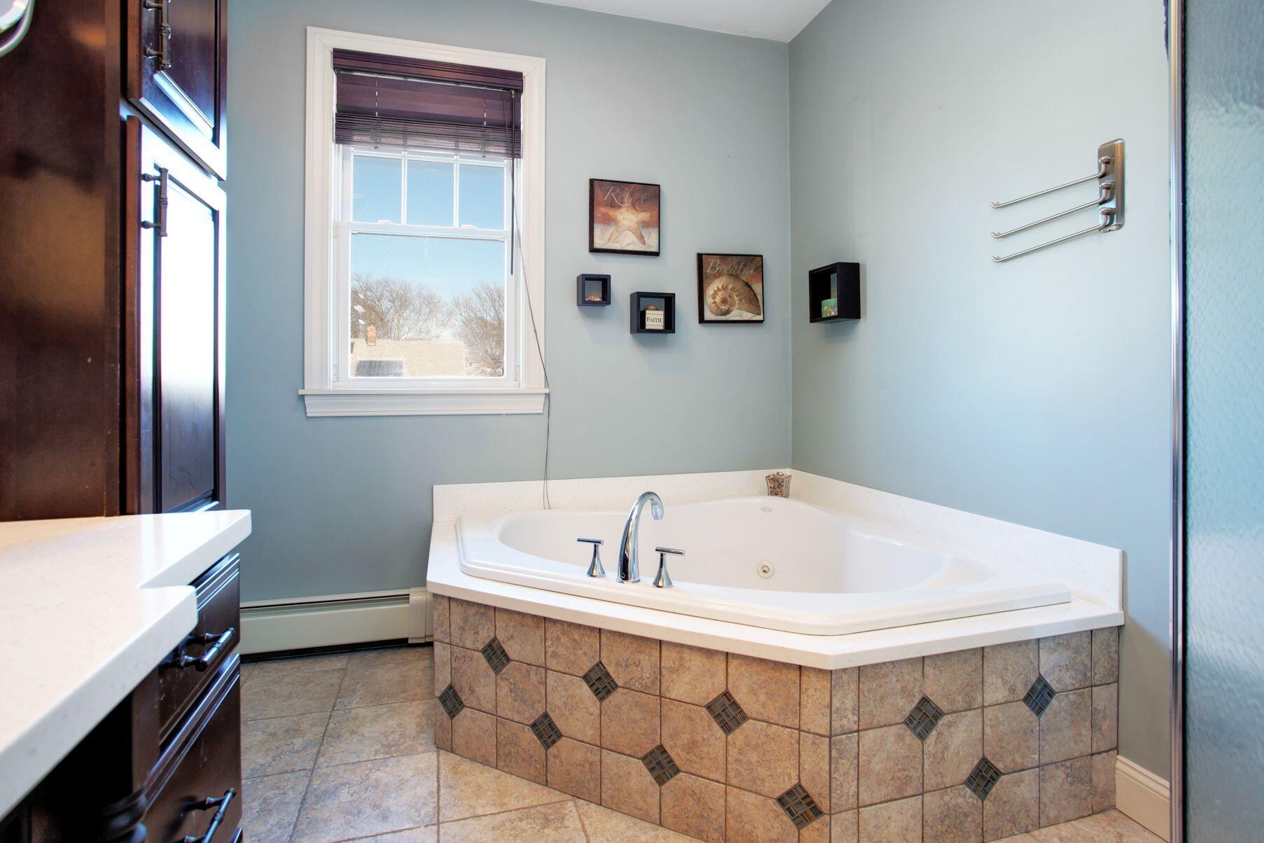 1 Calumet Road Fairhaven, MA 02719 - Photo 16 of 30 a bath tub sitting in a bathroom next to a window