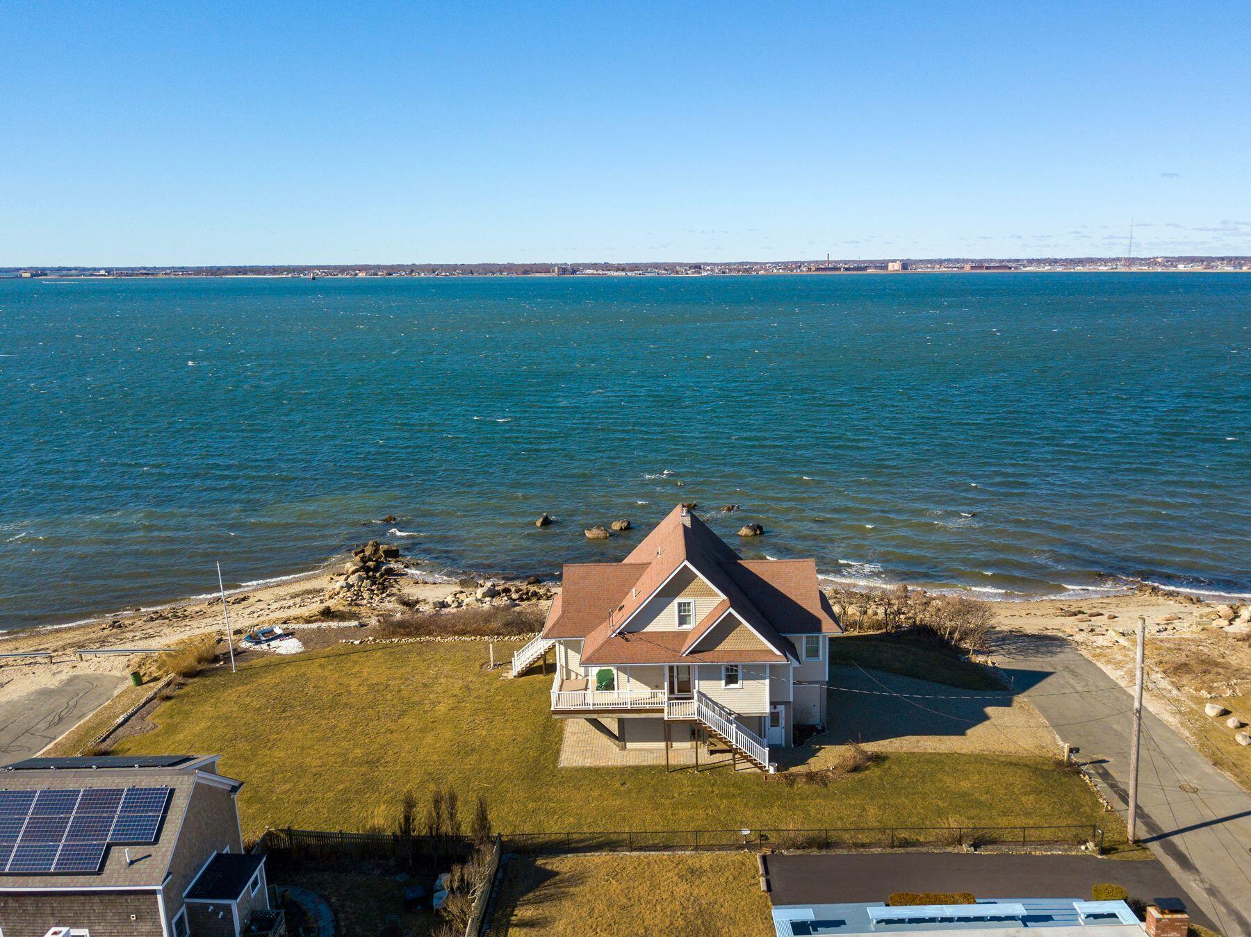 1 Calumet Road Fairhaven, MA 02719 - Photo 3 of 30 a aerial view of a house with a lake view