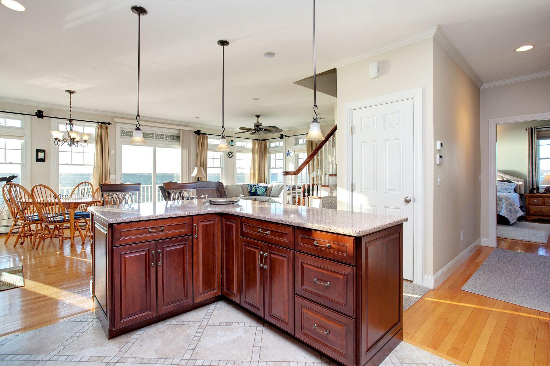 1 Calumet Road Fairhaven, MA 02719 - Photo 8 of 30 a kitchen with stainless steel appliances granite countertop a sink a stove and a wooden floor