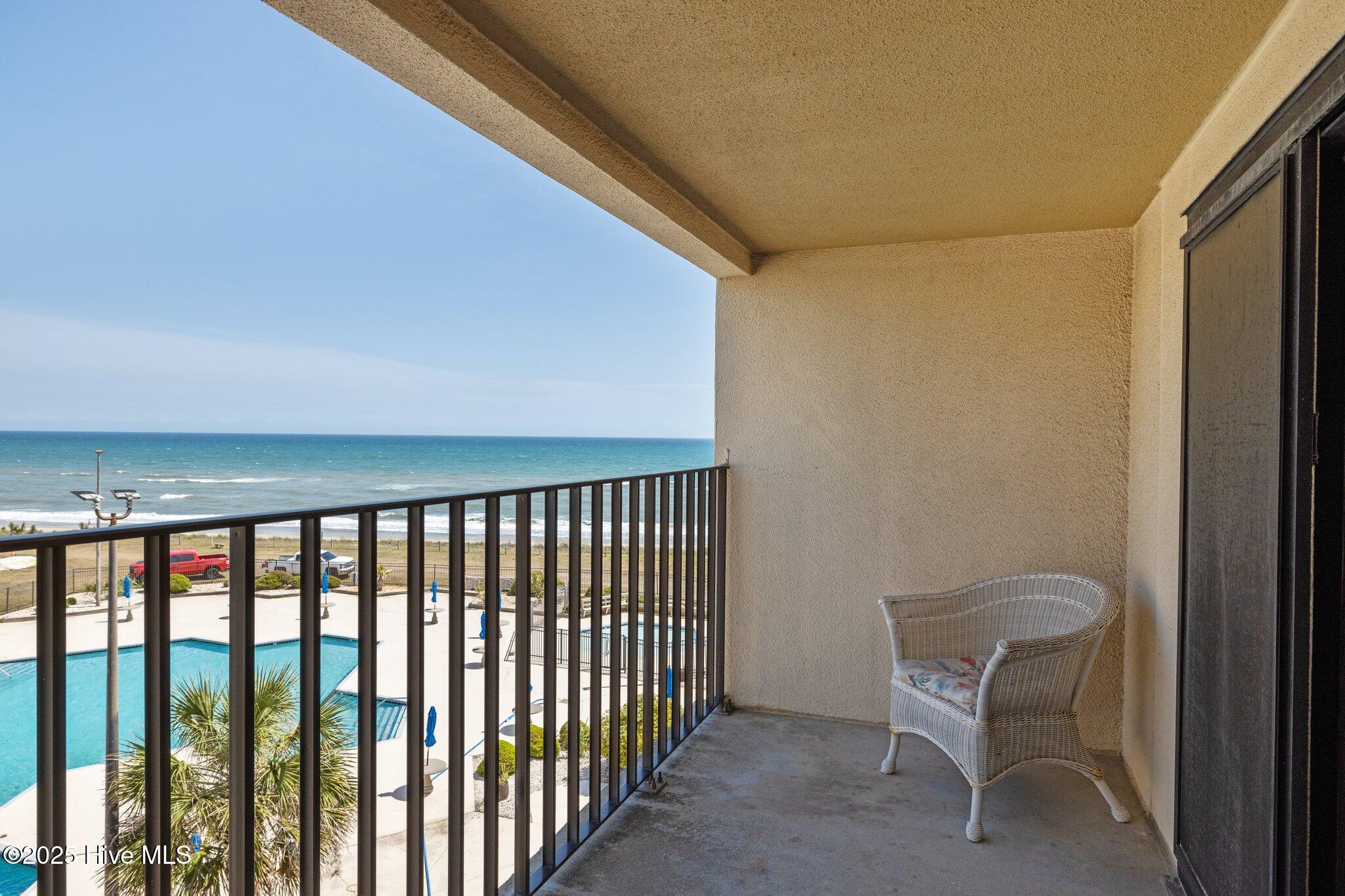 1505 Salter Path Road, Unit 409 Indian Beach, NC 28512 - Photo 26 of 35 Balcony with Pool and Ocean View