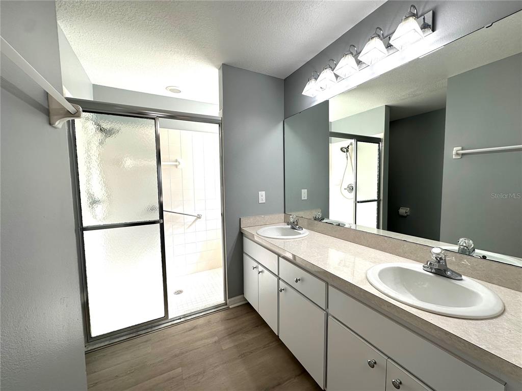 9706 Southwest 92nd Place Road Ocala, FL 34481 - Photo 15 of 82 a bathroom with a double vanity sink mirror and double