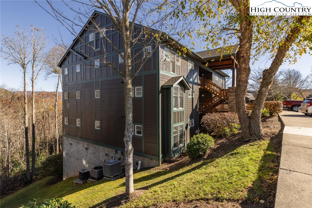 446 Peaceful Haven Drive, Unit 811 Boone, NC 28607 - Photo 1 of 19 a view of a house with a yard