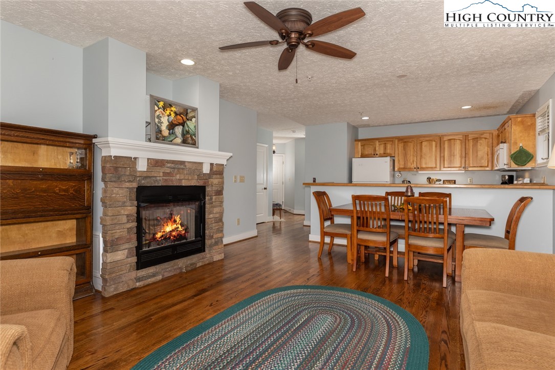 446 Peaceful Haven Drive, Unit 811 Boone, NC 28607 - Photo 12 of 19 a living room with furniture and a fireplace
