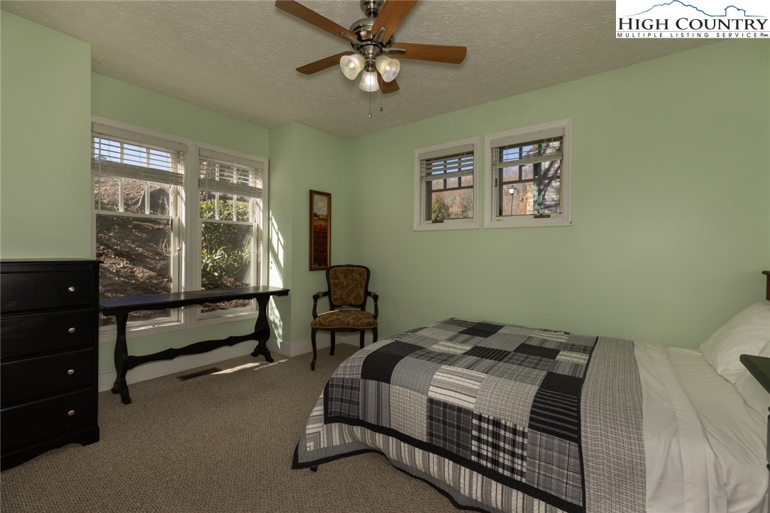 446 Peaceful Haven Drive, Unit 811 Boone, NC 28607 - Photo 13 of 19 a bedroom with a bed and a window