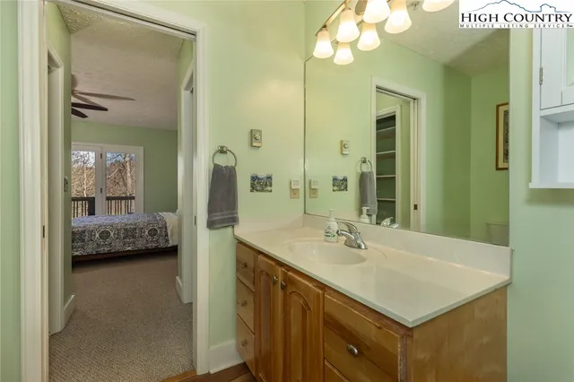 a bathroom with a sink a double vanity and a mirror