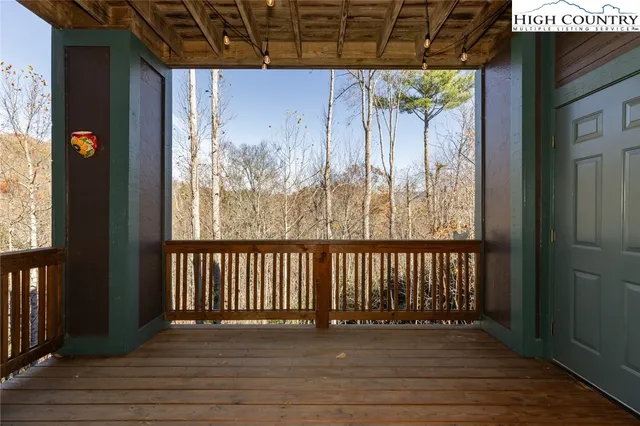 a view of a porch with wooden floor and outdoor space