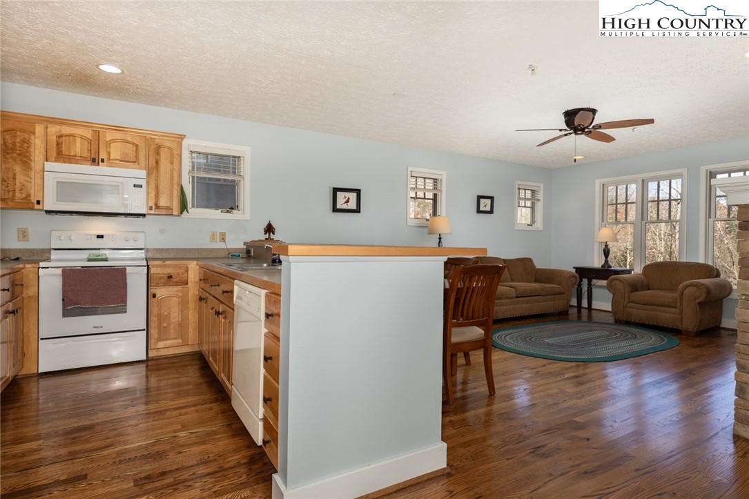 446 Peaceful Haven Drive, Unit 811 Boone, NC 28607 - Photo 10 of 19 a living room with furniture and a wooden floor
