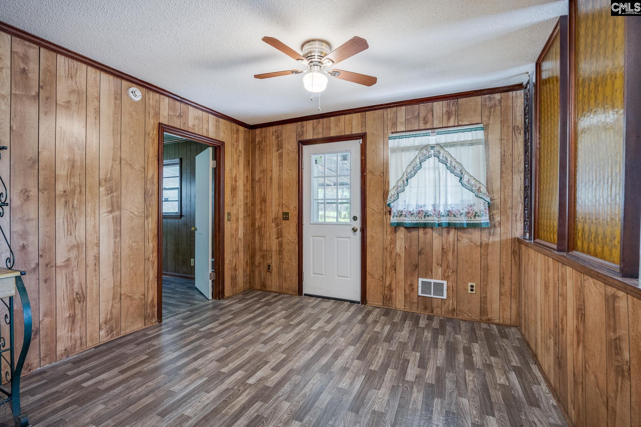 5666 Middleton Court Columbia, SC 29203 - Photo 15 of 42 a view of an empty room with wooden floor and a window