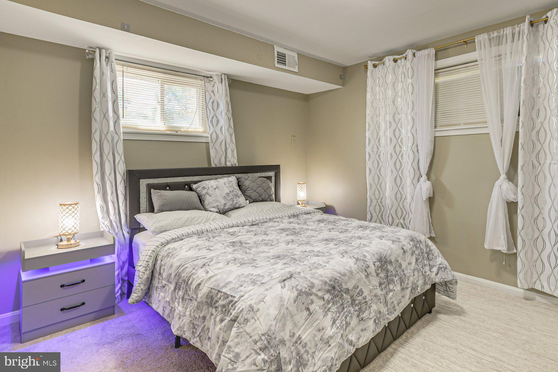 5929 Camberly Avenue Springfield, VA 22150 - Photo 12 of 24 a bedroom with a bed and a window