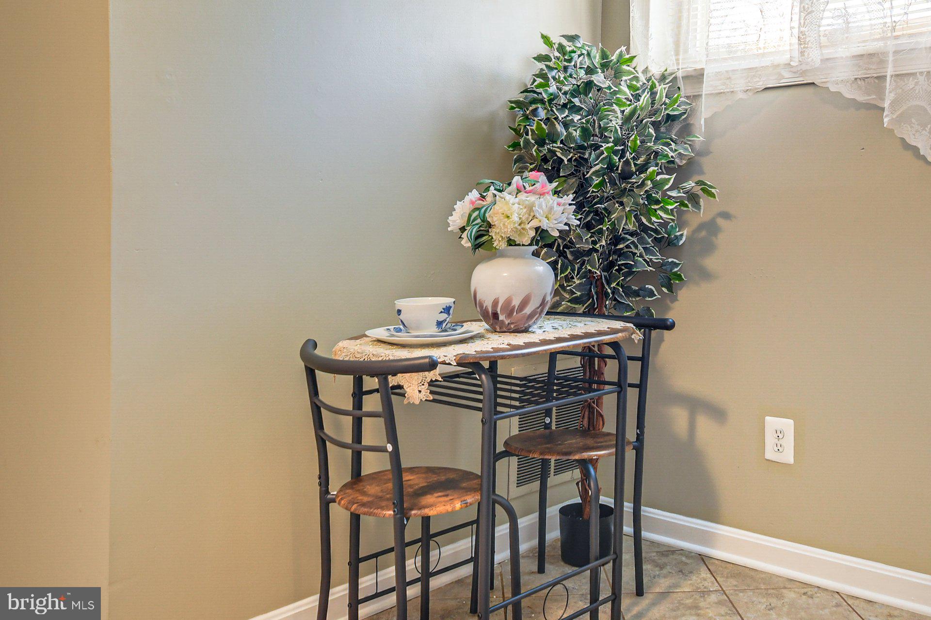 5929 Camberly Avenue Springfield, VA 22150 - Photo 4 of 24 a view of a dining room with furniture and wooden floor