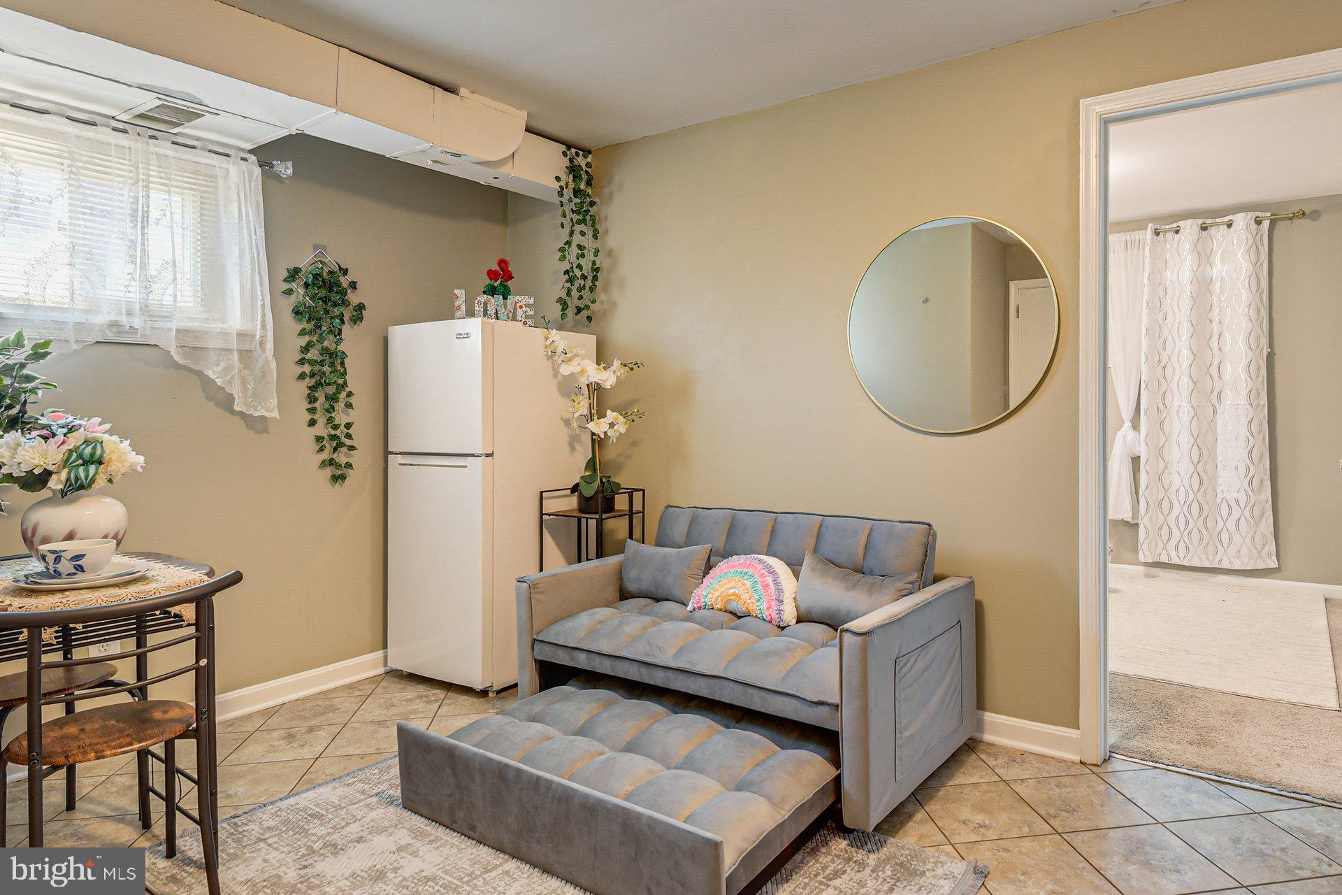 5929 Camberly Avenue Springfield, VA 22150 - Photo 5 of 24 a living room with furniture and a window