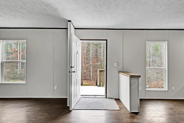 a view of front door with wooden floor