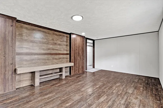 a view of room with wooden floor and window