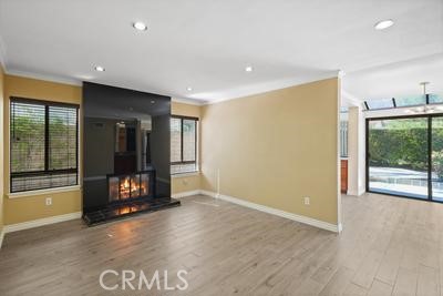19565 Turtle Springs Way Porter Ranch, CA 91326 - Photo 26 of 96 Family room virtual image of fire in fireplace