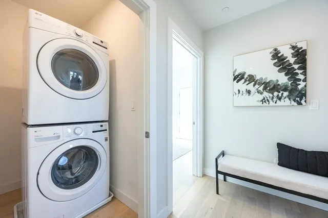 a view of a bedroom with washer and dryer