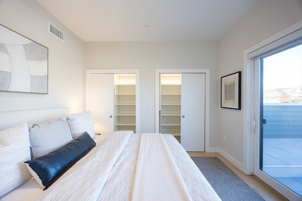 1 Loring Street, Unit 3 Somerville, MA 02143 - Photo 14 of 39 a bedroom with a bed and window