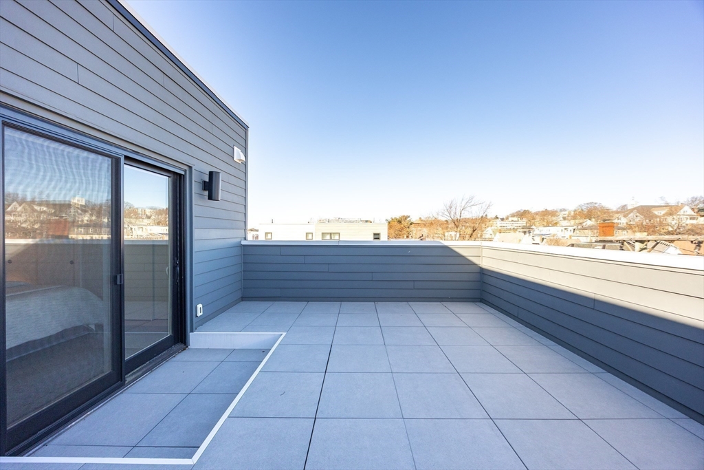 1 Loring Street, Unit 3 Somerville, MA 02143 - Photo 15 of 39 a bathroom with a toilet sink and shower
