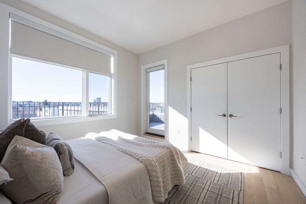 1 Loring Street, Unit 3 Somerville, MA 02143 - Photo 16 of 39 a bedroom with a bed and a window