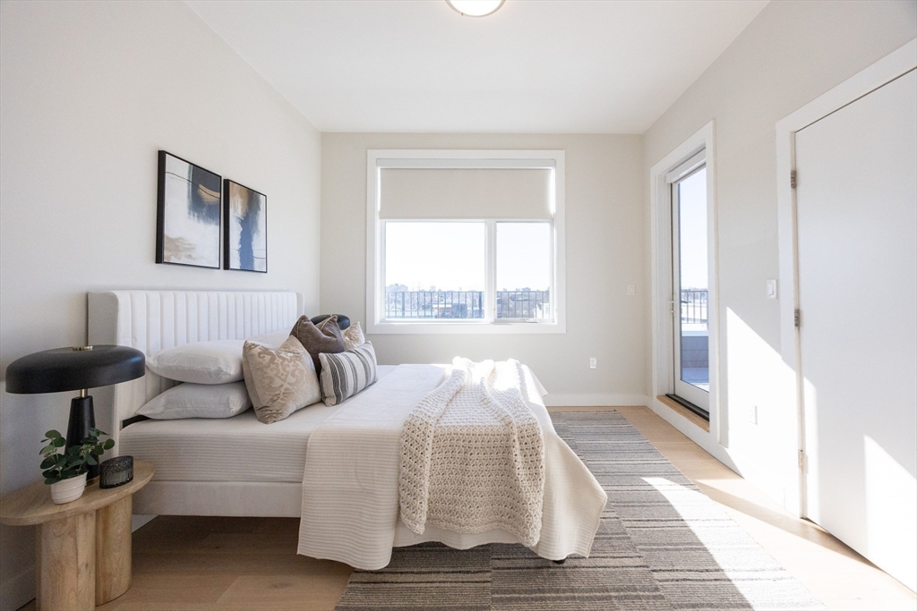 1 Loring Street, Unit 3 Somerville, MA 02143 - Photo 25 of 39 a bedroom with a bed and a large window