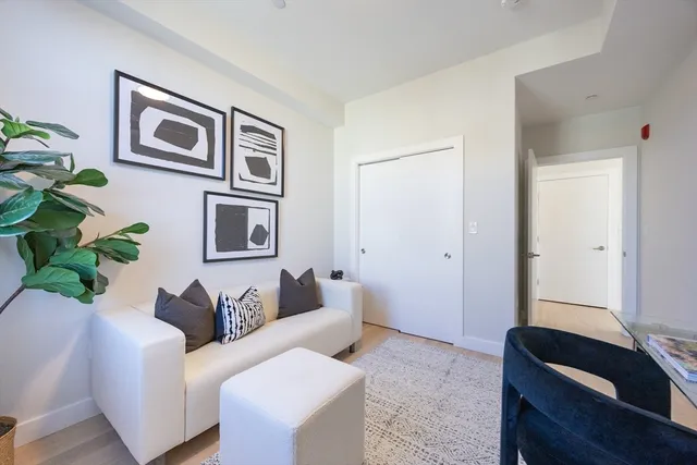 a living room with furniture and window