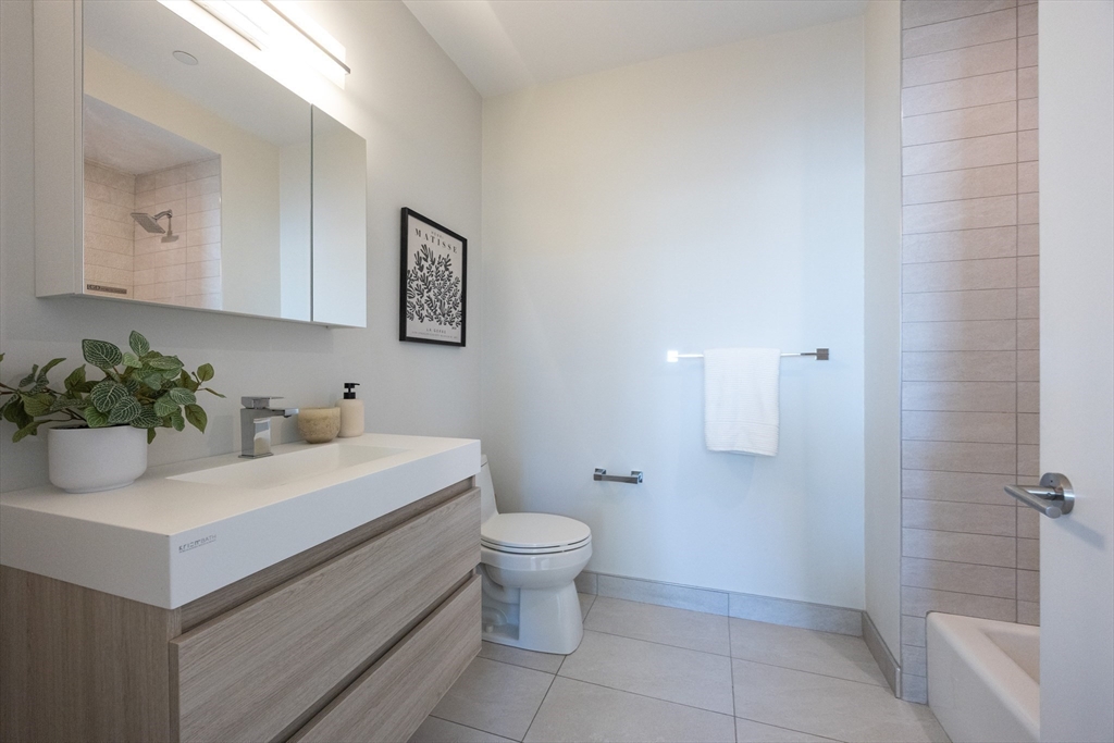 1 Loring Street, Unit 3 Somerville, MA 02143 - Photo 30 of 39 a bathroom with a sink toilet and shower