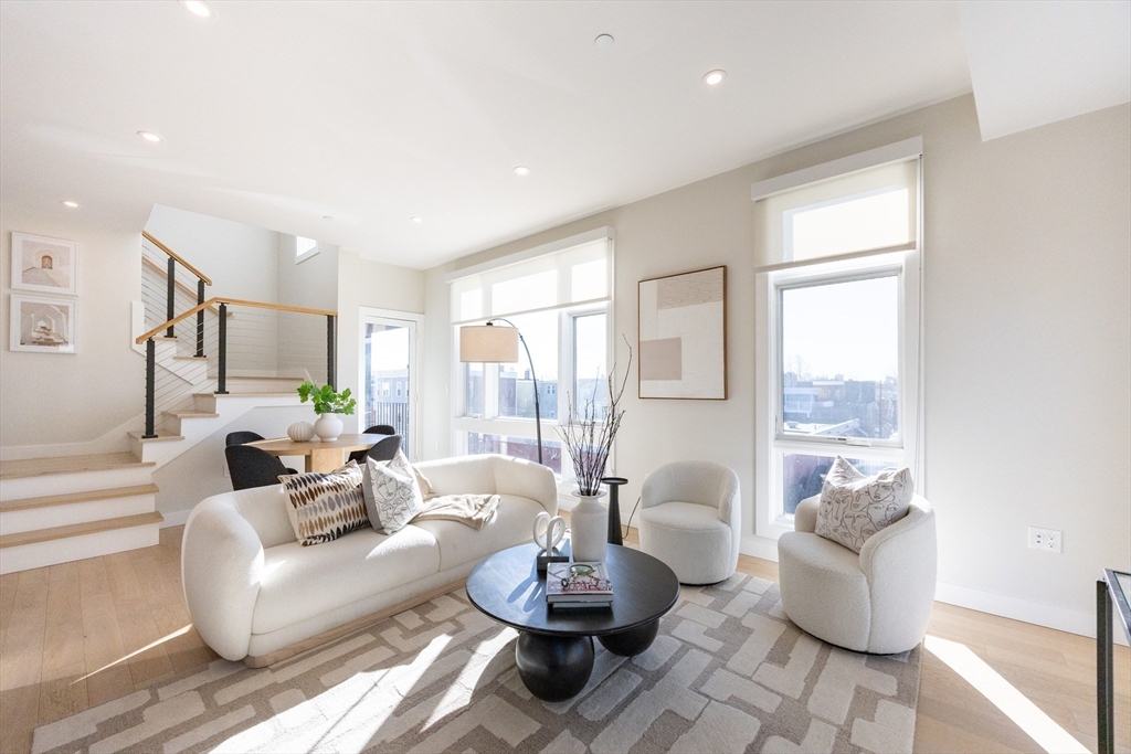 1 Loring Street, Unit 3 Somerville, MA 02143 - Photo 35 of 39 a living room with furniture and a large window