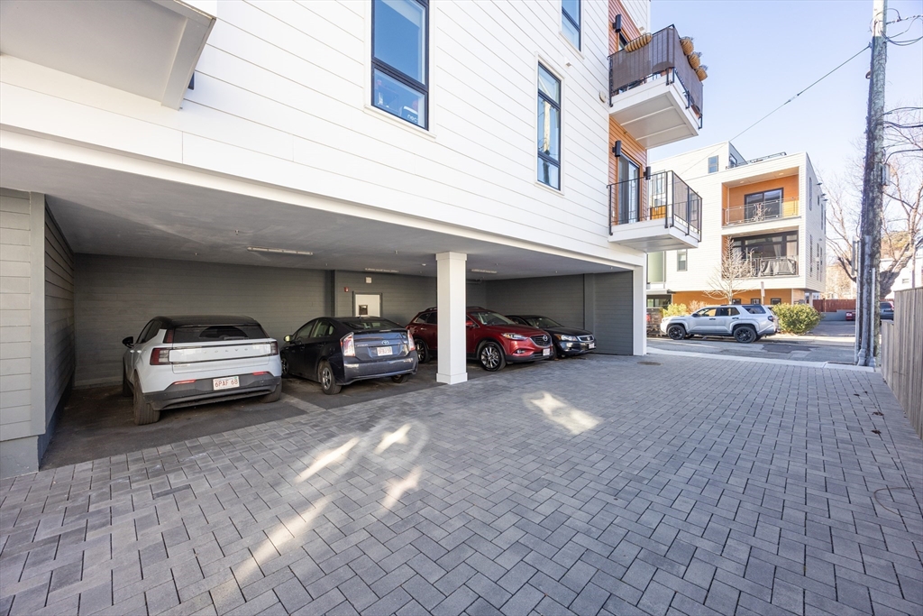 1 Loring Street, Unit 3 Somerville, MA 02143 - Photo 37 of 39 a car parked in front of a building
