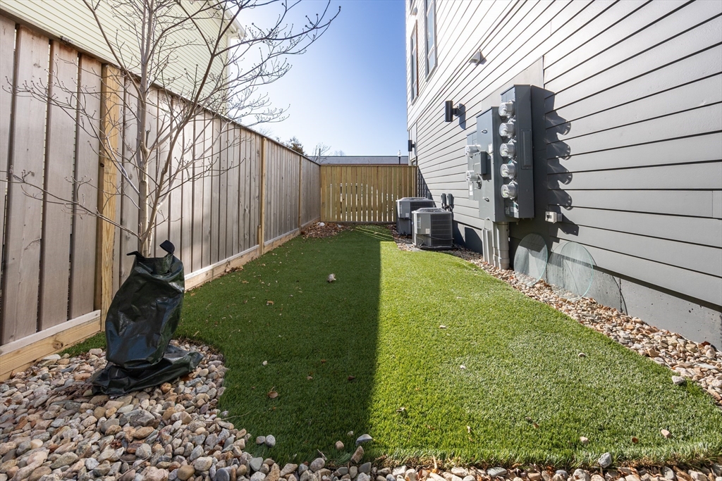 1 Loring Street, Unit 3 Somerville, MA 02143 - Photo 38 of 39 a view of a back yard of the house