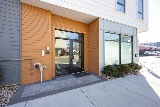 a view of a front door and wooden house