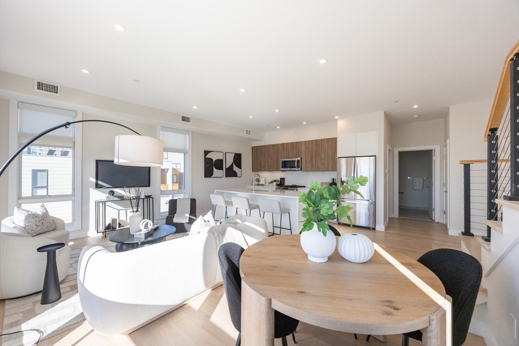 1 Loring Street, Unit 3 Somerville, MA 02143 - Photo 4 of 39 a view of a dining room with furniture
