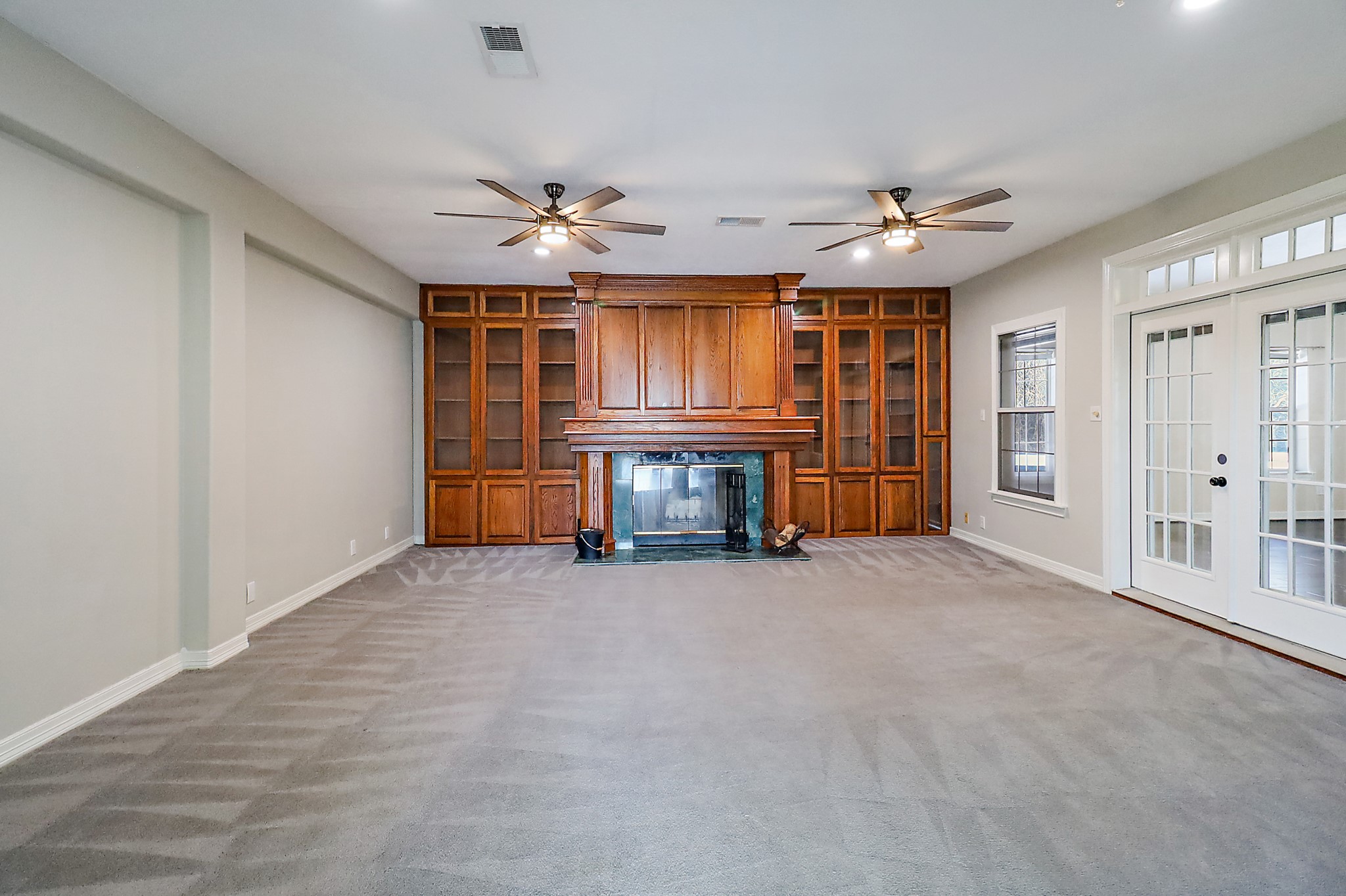 1306 Spring Branch Drive Baytown, TX 77523 - Photo 37 of 38 a view of empty room with a fireplace and cabinet