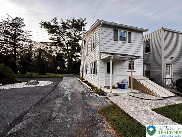 a view of a house with swimming pool