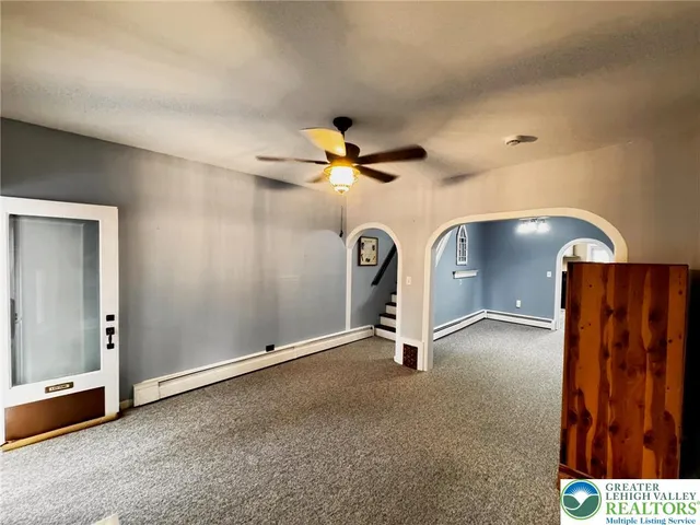 a view of an empty room with a window