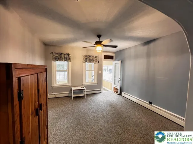 a view of a livingroom with a staircase