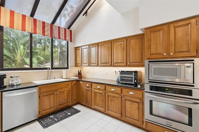 a bedroom with furniture and a large window